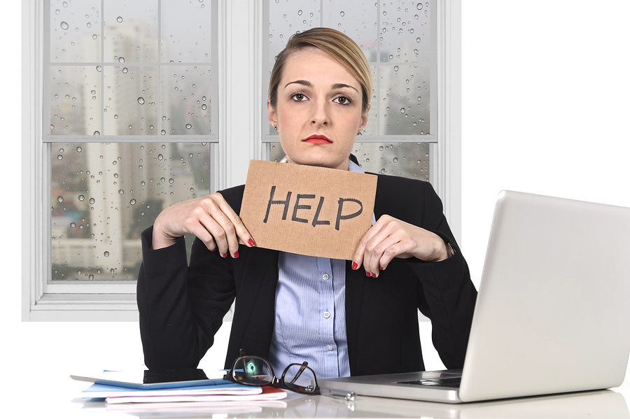 Young Stressed Businesswoman Holding Help Sign Overworked At Off